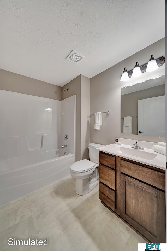 full bathroom featuring vanity, toilet, a textured ceiling, and bathing tub / shower combination