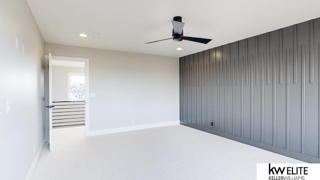 empty room featuring a ceiling fan, recessed lighting, and baseboards