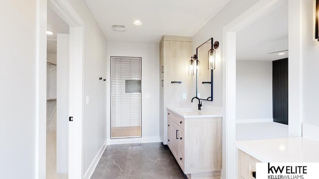 bathroom featuring vanity, walk in shower, and tile patterned floors