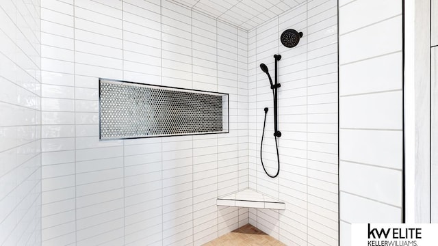 bathroom with tiled shower