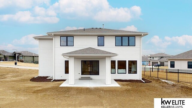 rear view of property featuring a patio