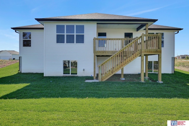 rear view of property with a deck and a lawn