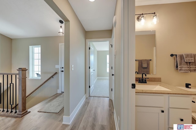 bathroom with hardwood / wood-style floors and vanity