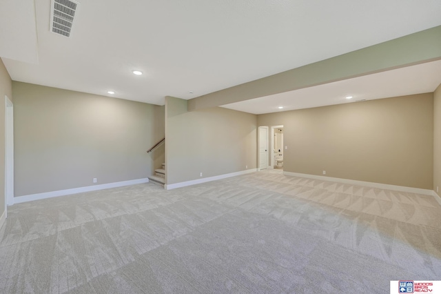 empty room featuring light colored carpet