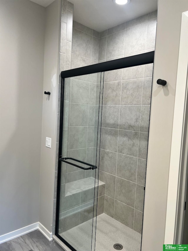 bathroom with walk in shower and hardwood / wood-style floors