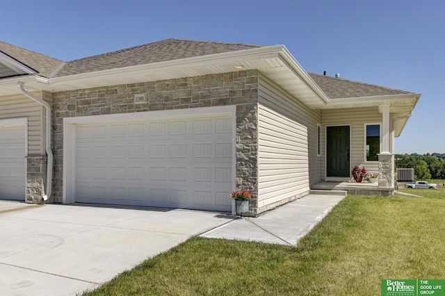 view of front of house with roof with shingles, a garage, stone siding, and central AC