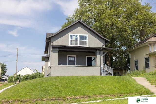 view of front of home with a front yard