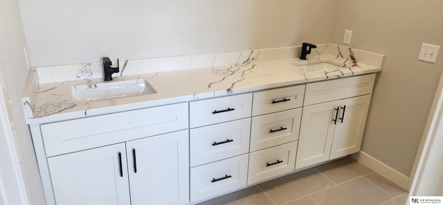 bathroom featuring tile patterned flooring and vanity