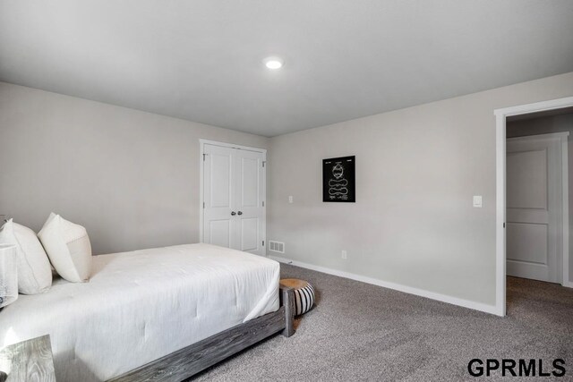 carpeted bedroom with a closet