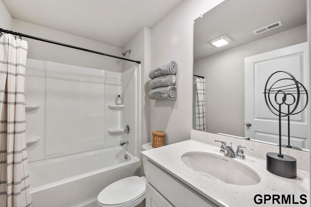 full bathroom featuring vanity, toilet, and shower / bath combo