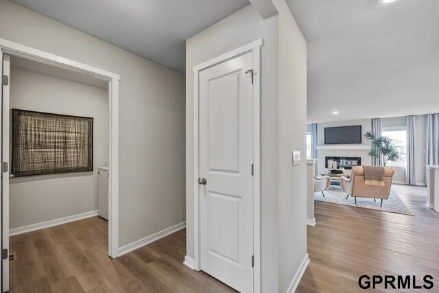 corridor with dark hardwood / wood-style floors