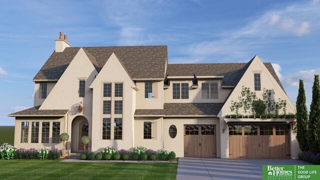 view of front of house with a garage and a front lawn