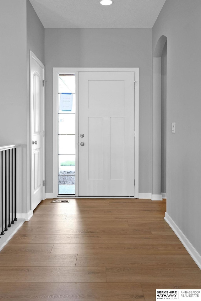 foyer entrance featuring hardwood / wood-style flooring