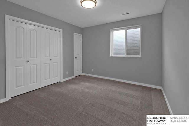 unfurnished bedroom with carpet floors