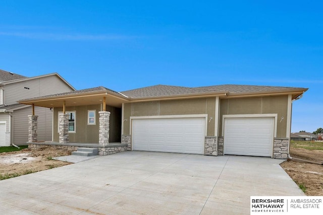 prairie-style home featuring a garage