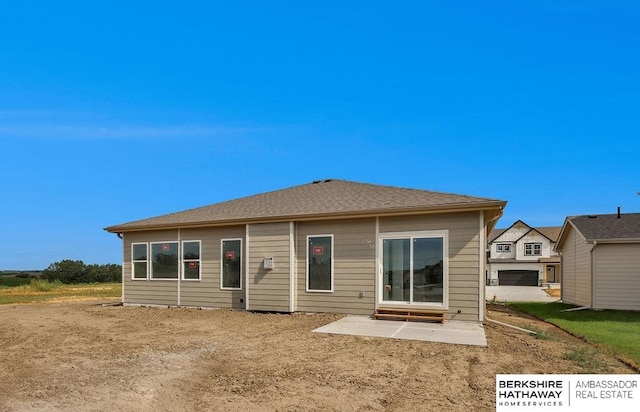 back of property with a patio area