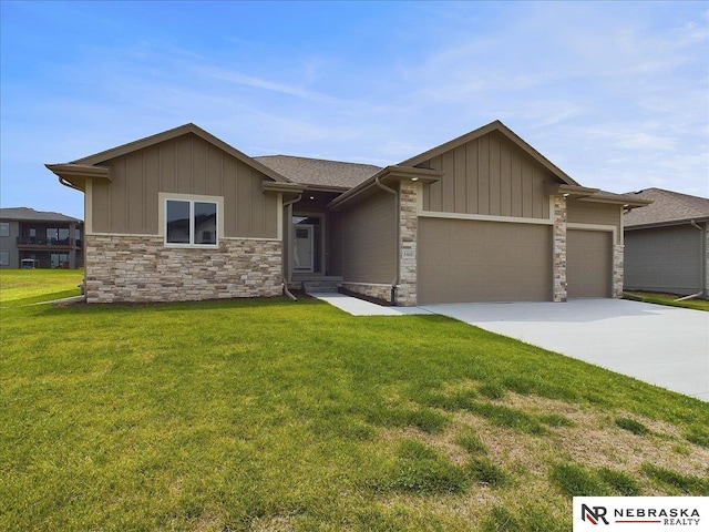 view of front of house with a garage and a front yard