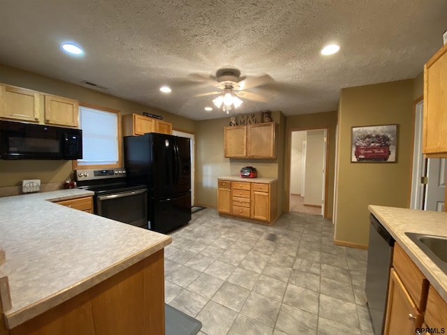 kitchen featuring visible vents, recessed lighting, black appliances, and light countertops