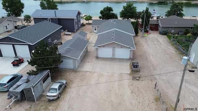 bird's eye view with a residential view and a water view