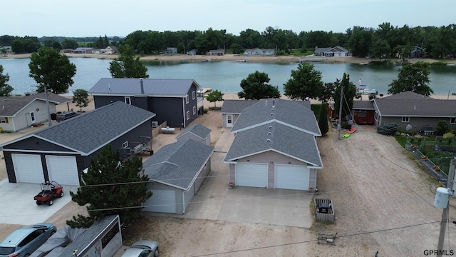 birds eye view of property with a residential view and a water view