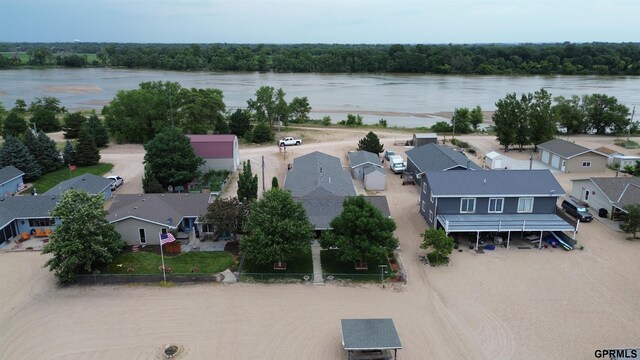 drone / aerial view with a residential view and a water view