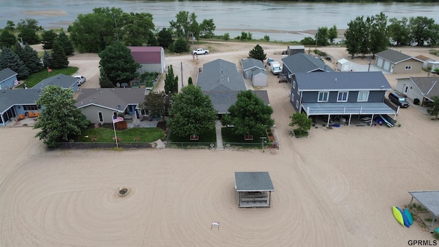 bird's eye view with a residential view and a water view