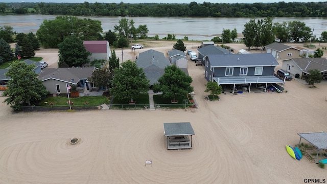 birds eye view of property featuring a residential view and a water view