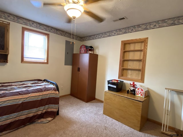 bedroom featuring electric panel, light colored carpet, visible vents, and baseboards