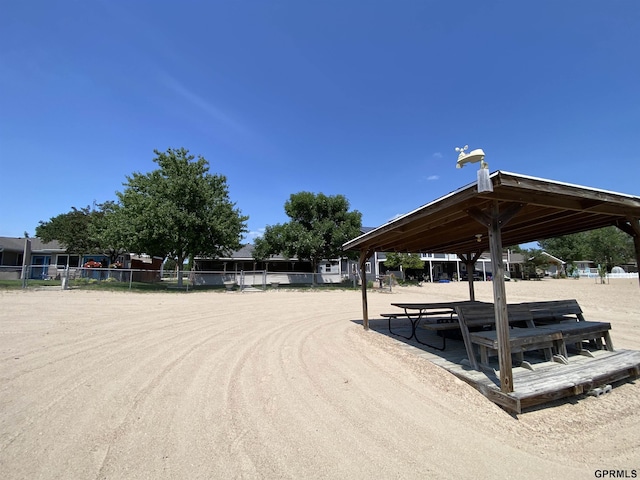 view of community with fence