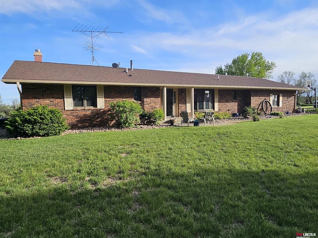 single story home with a patio and a front yard