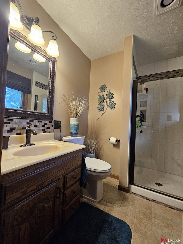 bathroom with an enclosed shower, backsplash, a textured ceiling, and toilet