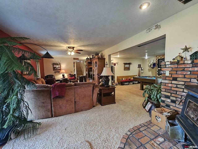 living room featuring ceiling fan, carpet, pool table, and a textured ceiling