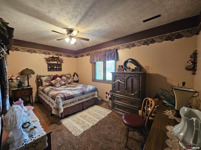 carpeted bedroom featuring a textured ceiling and ceiling fan