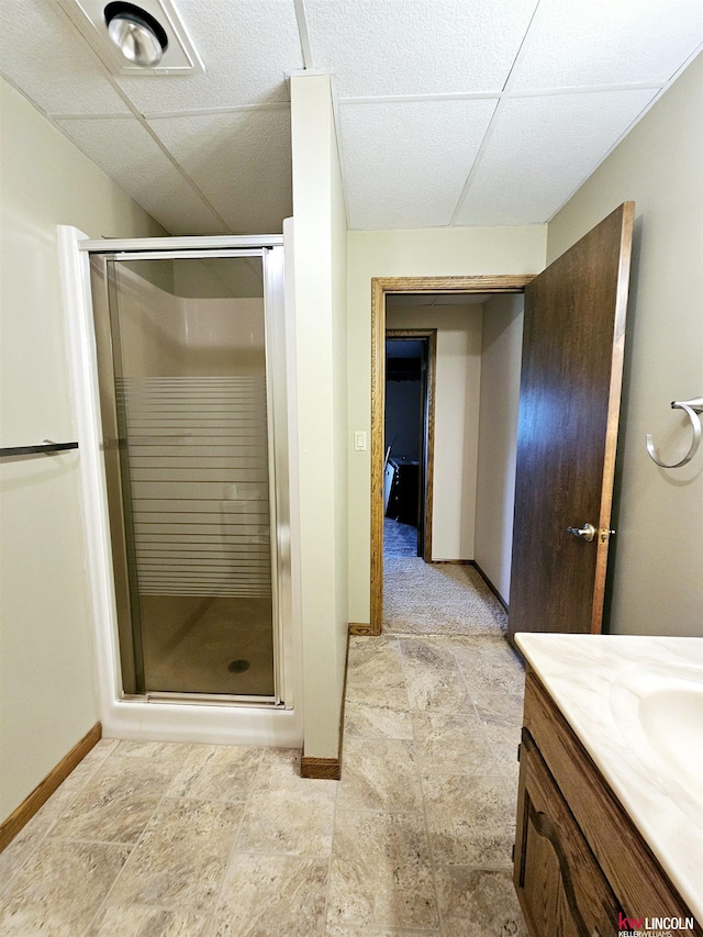 bathroom with vanity and a shower with door