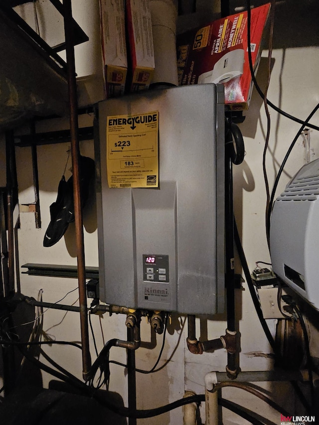 utility room with tankless water heater