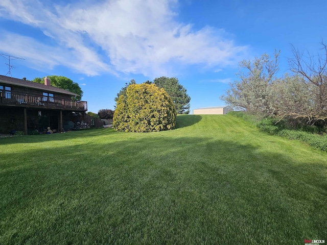 view of yard featuring a deck