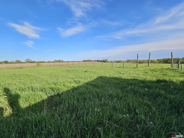 view of yard with a rural view