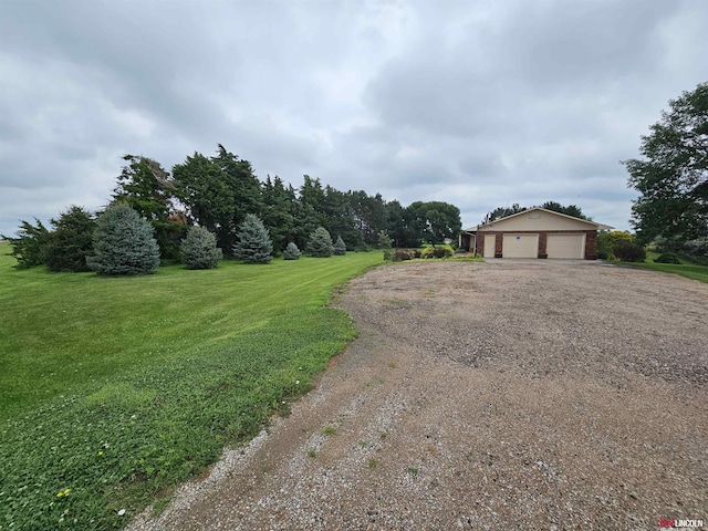 view of front of property with a garage and a front lawn