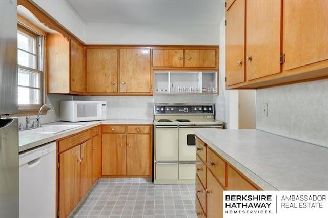 kitchen with sink and white appliances