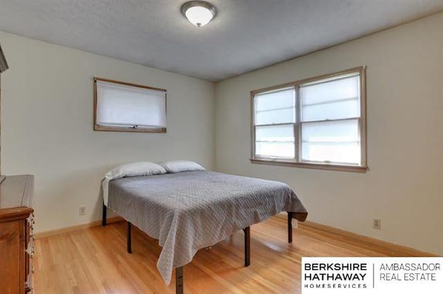 bedroom featuring light wood-type flooring