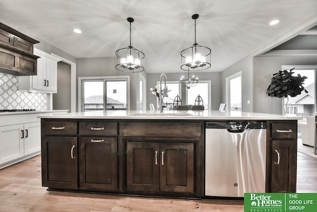 19058 Camelback Cir, Gretna, NE 68136 - kitchen featuring hanging light fixtures, white cabinets, dishwasher, and a center island