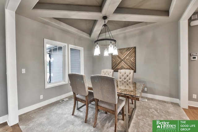 19058 Camelback Cir, Gretna, NE 68136 - dining space featuring an inviting chandelier, coffered ceiling, and beam ceiling