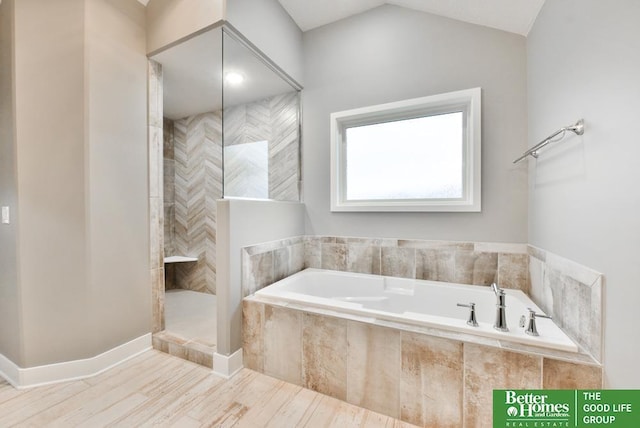 19058 Camelback Cir, Gretna, NE 68136 - bathroom with independent shower and bath, vaulted ceiling, and hardwood / wood-style flooring