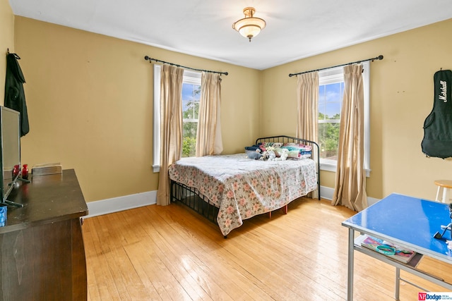 bedroom with light wood-type flooring