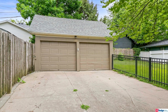 garage featuring a yard