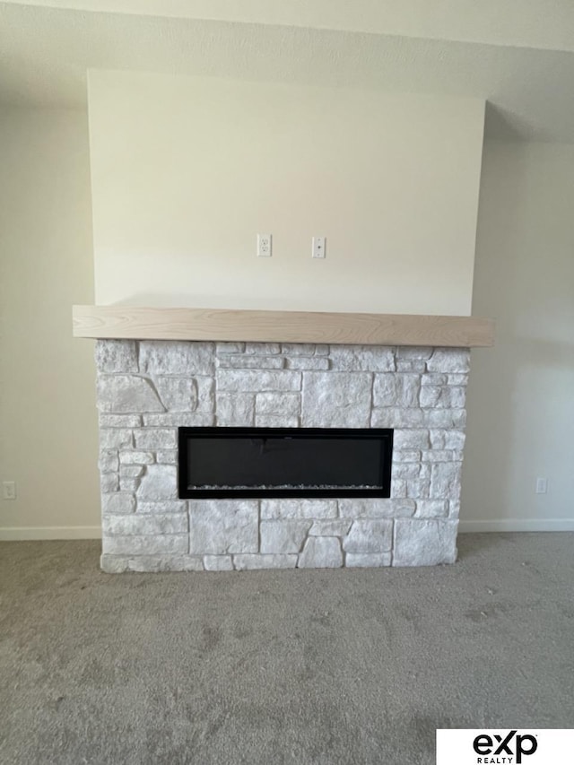 room details with carpet floors, a fireplace, and baseboards