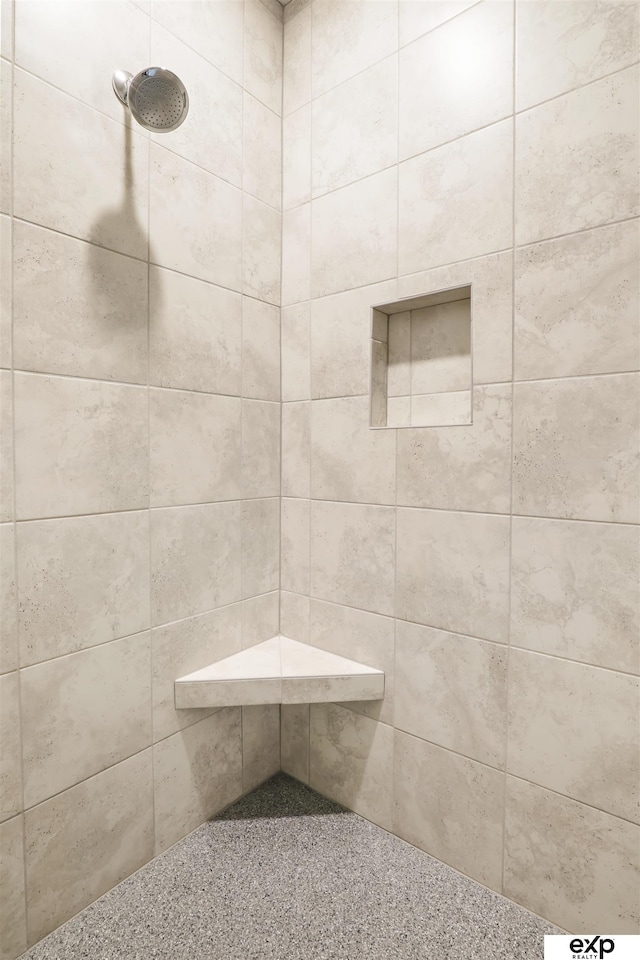 bathroom with tiled shower