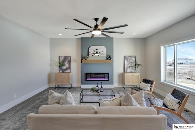 living room with ceiling fan, light colored carpet, and plenty of natural light