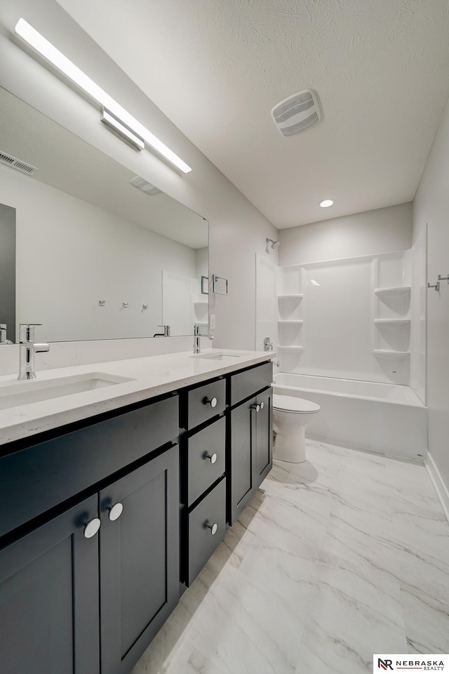 full bathroom with toilet, shower / bathing tub combination, double sink vanity, and tile patterned flooring