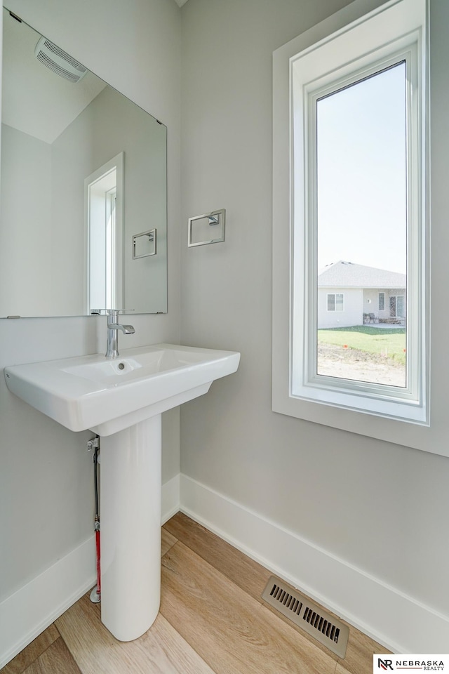 bathroom with sink and hardwood / wood-style floors